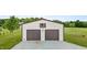 Two-bay outbuilding on a sprawling lot with a gravel driveway and a grassy yard at 3465 Covington Trl, Mebane, NC 27302