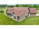 Exterior shot of the home featuring neutral siding, a screened-in porch, and expansive yard at 3465 Covington Trl, Mebane, NC 27302