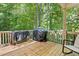 Back deck featuring trees and nature surrounding at 347 Manchester Trl, Clayton, NC 27527