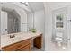 Bathroom featuring a sink, toilet and large vanity mirror at 347 Manchester Trl, Clayton, NC 27527