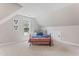 Comfortable bedroom with neutral walls, carpet, and a black metal bed frame at 347 Manchester Trl, Clayton, NC 27527