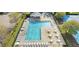 Aerial view of a community pool with lounge chairs and tables, perfect for relaxation and socializing at 347 Manchester Trl, Clayton, NC 27527