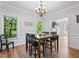 Bright dining room features hardwood floors, a chandelier, and plenty of natural light at 347 Manchester Trl, Clayton, NC 27527