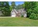Charming home with manicured lawn, two-car garage, and inviting brick-lined front porch at 347 Manchester Trl, Clayton, NC 27527