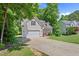 Charming home featuring a manicured lawn, two-car garage, and inviting brick-lined front porch at 347 Manchester Trl, Clayton, NC 27527