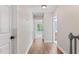 Bright hallway with wood floors that leads to a bedroom and bathroom at 347 Manchester Trl, Clayton, NC 27527