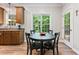 This kitchen features wooden cabinets, stainless steel appliances, and a dining area at 347 Manchester Trl, Clayton, NC 27527