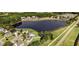 Aerial view of a neighborhood next to a pond at 347 Manchester Trl, Clayton, NC 27527