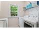 Bright laundry room with modern washer and dryer, and natural light at 347 Manchester Trl, Clayton, NC 27527