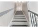 Staircase featuring gray treads and white risers leading to an upper level of the home at 347 Manchester Trl, Clayton, NC 27527