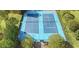 Aerial view showcasing the community tennis courts, surrounded by greenery for recreational enjoyment at 347 Manchester Trl, Clayton, NC 27527