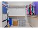 Walk-in closet with shelving and ample storage for shoes and clothing at 347 Manchester Trl, Clayton, NC 27527