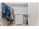 Walk-in closet offering custom shelving and ample storage space with a built-in dresser at 347 Manchester Trl, Clayton, NC 27527