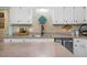 Well-equipped kitchen with white cabinetry, updated countertops, and stainless steel appliances at 4 Barkridge Ct, Durham, NC 27713