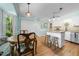Charming kitchen nook with breakfast bar, hardwood floors, and a backyard view at 4 Barkridge Ct, Durham, NC 27713