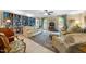 Cozy living room with built-in bookshelves, plush seating, and ample natural light at 4 Barkridge Ct, Durham, NC 27713