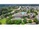 An aerial view showcasing neighborhood's premier amenities: pool, tennis court, and clubhouse at 4003 Jockey Club Cir, Cary, NC 27519