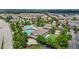 An aerial view highlighting resort-style neighborhood amenities with a pool, clubhouse, and tennis courts at 4003 Jockey Club Cir, Cary, NC 27519