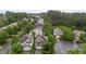 Aerial view of a tranquil neighborhood with lush trees and a quiet street with well-maintained homes at 4003 Jockey Club Cir, Cary, NC 27519