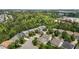 Beautiful aerial view of suburban homes backing onto a dense green forest at 4003 Jockey Club Cir, Cary, NC 27519