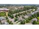 An aerial shot showcasing the neighborhood with lush trees surrounding beautiful single-Gathering homes at 4003 Jockey Club Cir, Cary, NC 27519