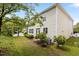 Exterior of the home showcasing the backyard, landscaping, and residential charm at 4003 Jockey Club Cir, Cary, NC 27519