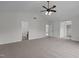 This bedroom features carpeting, a fan, multiple doors, and a window at 4003 Jockey Club Cir, Cary, NC 27519