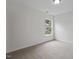 Bedroom showcasing neutral walls and carpet with large window at 4003 Jockey Club Cir, Cary, NC 27519