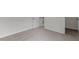 Spacious bedroom with neutral carpet and entry to another room at 4003 Jockey Club Cir, Cary, NC 27519