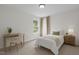 Inviting bedroom featuring ample natural light, desk and a comfortable bed at 4003 Jockey Club Cir, Cary, NC 27519