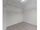 This is a closet with shelving and carpeted floors at 4003 Jockey Club Cir, Cary, NC 27519