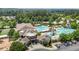 Aerial view showcases the community clubhouse with pools, playground, and parking at 4003 Jockey Club Cir, Cary, NC 27519