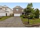 Charming brick front home with a two-car garage and well-maintained landscaping at 4003 Jockey Club Cir, Cary, NC 27519