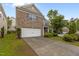 Charming brick home with a well-manicured lawn and a two-car garage at 4003 Jockey Club Cir, Cary, NC 27519