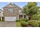 Charming brick home with a manicured front yard and a two-car garage at 4003 Jockey Club Cir, Cary, NC 27519