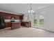 The kitchen boasts tile floors, wooden cabinets, granite countertops, and stainless steel appliances at 4003 Jockey Club Cir, Cary, NC 27519