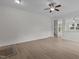 Spacious living room with modern light wood floors and an open layout at 4003 Jockey Club Cir, Cary, NC 27519
