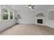 Light and airy living room featuring a fireplace and light wood floors at 4003 Jockey Club Cir, Cary, NC 27519