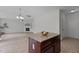 Open floor plan from the kitchen with a granite island to the spacious living room with fireplace at 4003 Jockey Club Cir, Cary, NC 27519