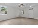 Bright living room features light wood floors, large windows, and fresh white paint at 4003 Jockey Club Cir, Cary, NC 27519