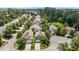 Street view of houses showing well-manicured lawns and mature trees in a quiet neighborhood at 4003 Jockey Club Cir, Cary, NC 27519