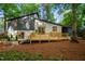 Expansive backyard featuring a spacious wooden deck and sliding glass doors to the home's interior at 4012 Castle Ct, Raleigh, NC 27613