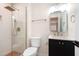 Modern bathroom features glass shower,rainfall shower head, and sleek vanity at 4012 Castle Ct, Raleigh, NC 27613