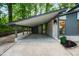 Covered carport providing sheltered parking with a convenient entrance and landscaped surroundings at 4012 Castle Ct, Raleigh, NC 27613