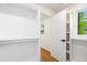 Spacious walk-in closet with ample shelving and natural light from a window at 4012 Castle Ct, Raleigh, NC 27613