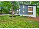 Beautiful home with a modern design, lush lawn, and unique architectural elements, creating a welcoming and appealing facade at 4012 Castle Ct, Raleigh, NC 27613