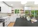 Modern kitchen with sleek countertops, stainless steel appliances, and a bright, airy atmosphere at 4012 Castle Ct, Raleigh, NC 27613