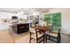 Bright kitchen features an island with seating and a dining area with sliding glass doors at 4012 Castle Ct, Raleigh, NC 27613