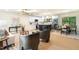Open living space showcasing the living room, kitchen and dining area in neutral tones at 4012 Castle Ct, Raleigh, NC 27613