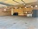 Spacious garage features a high ceiling, ample lighting, and storage, ready for customization at 4016 Berman Edge Rd, Holly Springs, NC 27540